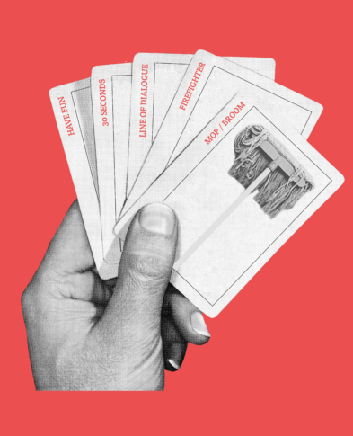 Image of hand holding deck of cards with a mop on one card, a prop for Short Cut 2023